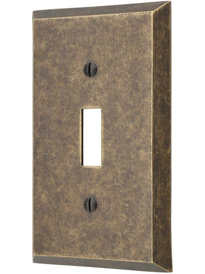 Traditional Forged Brass Single Toggle Switch Plate in Antique Brass.